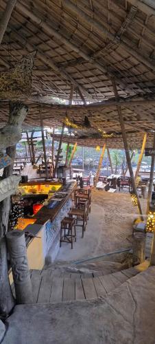 a patio with tables and chairs in a building at Coco Tent Seaview 360 in Ko Lanta