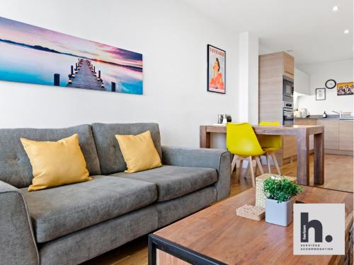 a living room with a couch and a table at Contractor Stays - 6 Units - City Centre - Siemens - NHS - Uni - Free Parking - Balcony in Hull