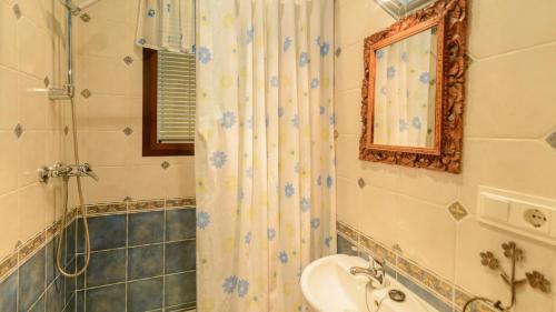 a bathroom with a shower and a sink and a toilet at Villa La Cola Nerja by Ruralidays in Nerja