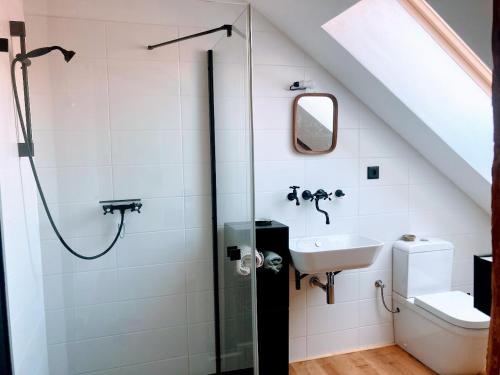 a bathroom with a shower and a sink at Klobucká manufaktura in Valašské Klobouky