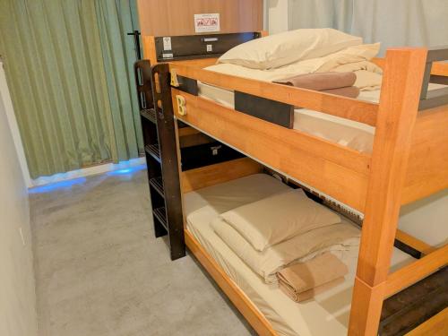 a couple of bunk beds in a room at Hostel JIN in Osaka