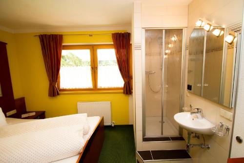 a bathroom with a sink and a shower at Apart Mountain-feeling in Kappl