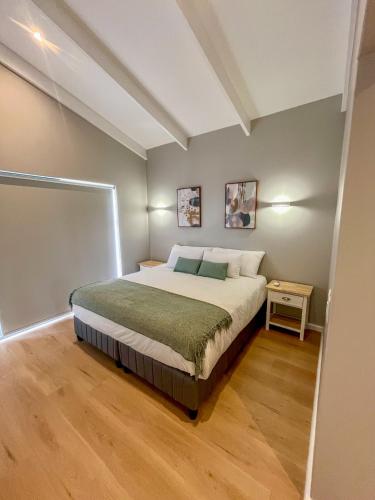 a bedroom with a bed in a room at 12 Langdown Ridge in Plettenberg Bay