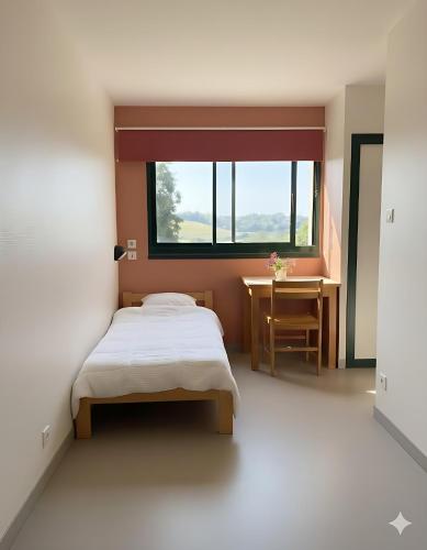 Llit o llits en una habitació de Ti menez Are