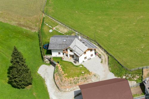 an aerial view of a house in a field at Ferienhaus "Larch Soge" in Racines