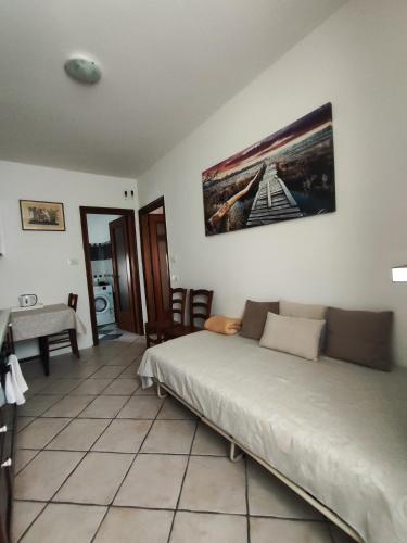 a bedroom with a bed and a table and a desk at Margherita in Seriate