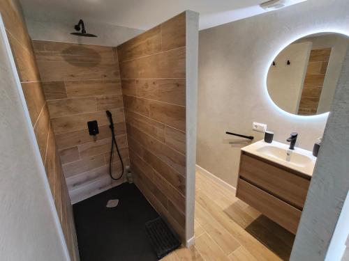a bathroom with a sink and a mirror at Can Freixa in Sant Pere de Torelló