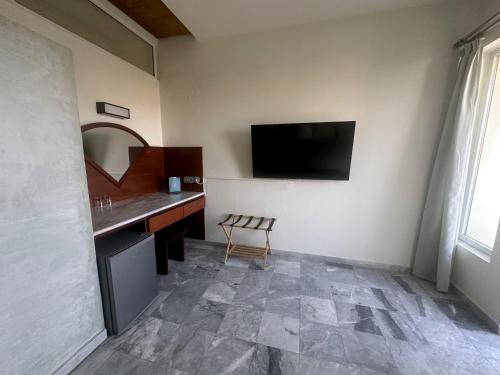 Телевизор и/или развлекательный центр в Rodon Hotel