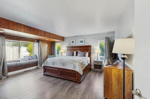 a large bedroom with a bed and a couch at Ocean View Retreat in Brookings