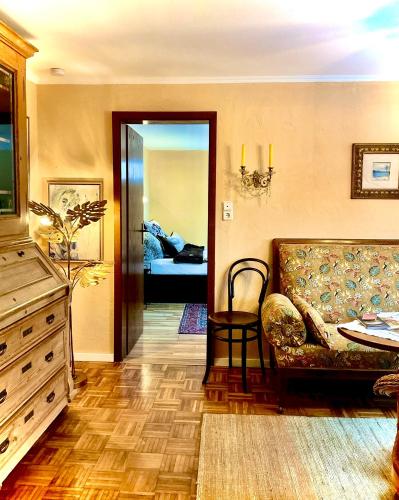 a living room with a couch and a table at Weserfeeling Apartment in Höxter in Höxter