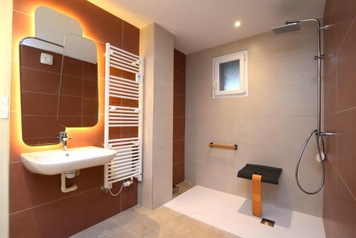 a bathroom with a sink and a shower at Maison VERNET - Hôtel Beauséjour in Le Béage