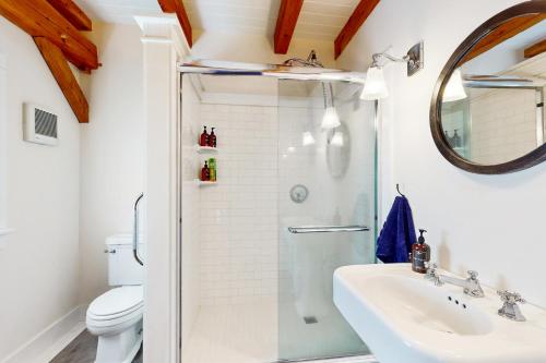 a bathroom with a shower and a sink at Hike, Bike, & Explore: Vermont Family Farmhouse! in New Haven