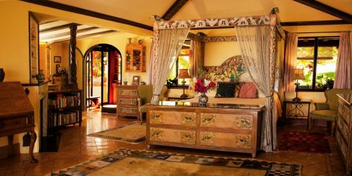 a bedroom with a dresser and a mirror at La Valise Los Cabos in Boca de la Vinorama