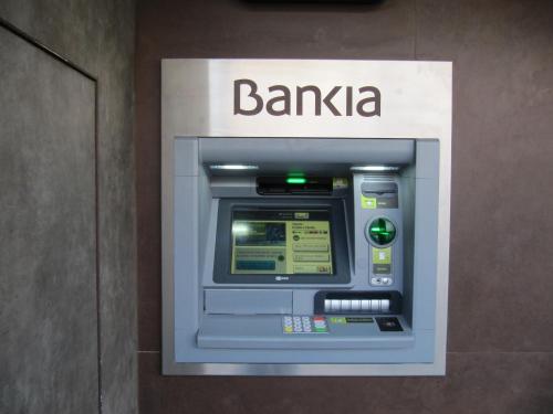 an atm machine with a bank sign on it at Apartamento " El Pueblo" in Mogán