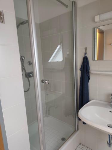 a bathroom with a shower and a sink at Apartment 10 in Surwold