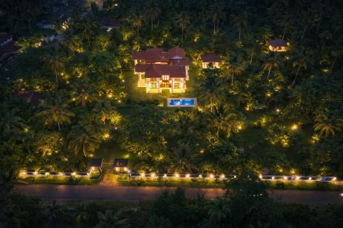 an aerial view of a house at night with lights at Welpalla Signature in Welpalla