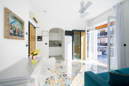 a living room with a couch and a table at La Residenza Aparthotel in Maiori