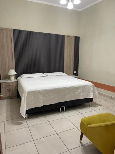 Postel nebo postele na pokoji v ubytování Casa Monaco