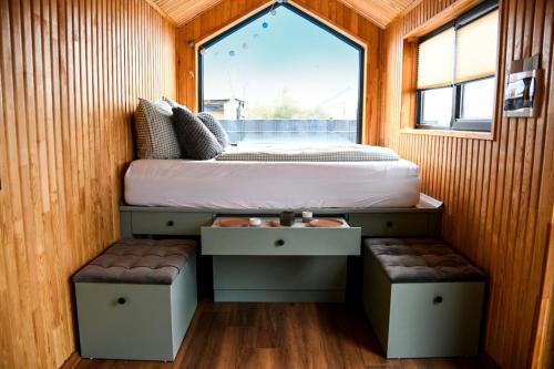 a bed in a small room with a window at Seebrise Adria in Altrip