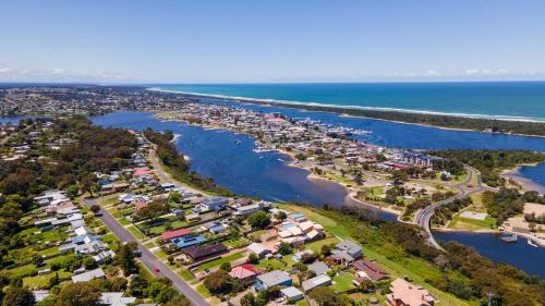 an aerial view of a town next to the water at Kalimna Holiday House in Kalimna