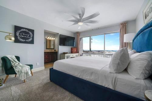 a bedroom with a large bed and a large window at Twin Palms - Beachfront Duplex with Ocean Views & Direct Beach Access in Destin