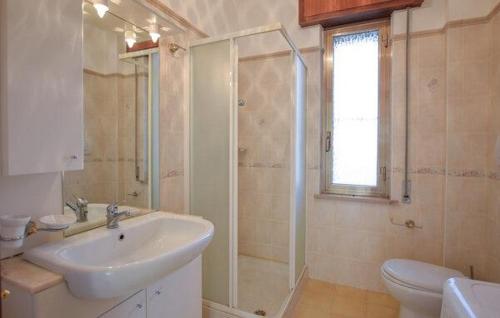 a bathroom with a sink and a shower and a toilet at Casa Vincenzo in Satriano