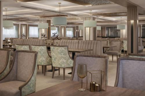 a dining room with tables and chairs and chandeliers at Five-Stars Deluxe River Kruz from Aswan to Luxor 3 Nights in Aswān