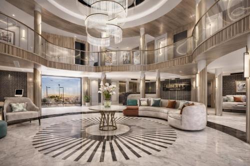 a living room with a couch and a table at Five-Stars Deluxe River Kruz from Aswan to Luxor 3 Nights in Aswān