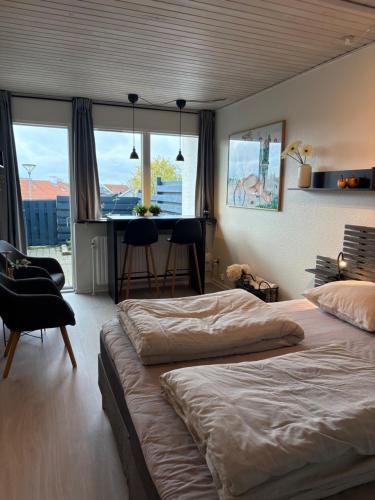 Tempat tidur dalam kamar di Bakkehegnet 2