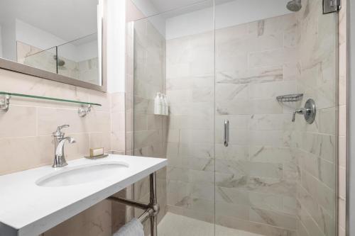 a bathroom with a sink and a shower at Cartwright Hotel Union Square - BW Premier Collection in San Francisco