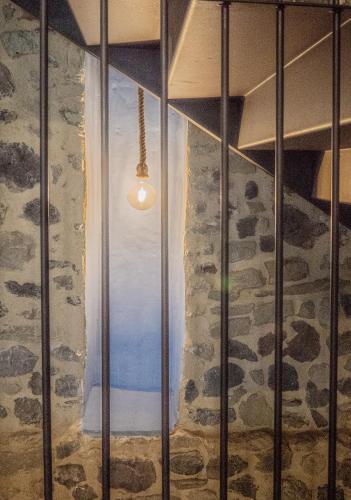 a window in a room with a stone wall at Mas Casalprim in Sant Feliu de Pallerols