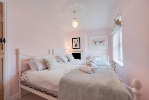 a child laying on a bed in a bedroom at 2 Bed in Holt oc-2195 in Holt