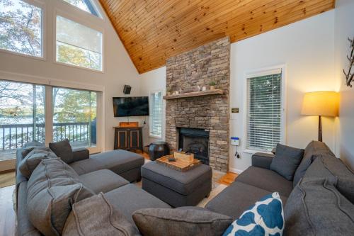 a living room with a couch and a fireplace at AAH Chalet by Railey Vacations in Oakland