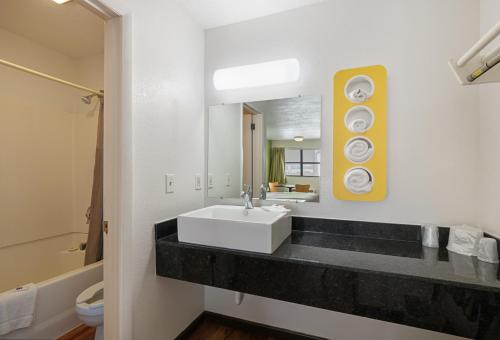 a bathroom with a sink and a mirror at Motel 6 Chattanooga, TN in Silverdale