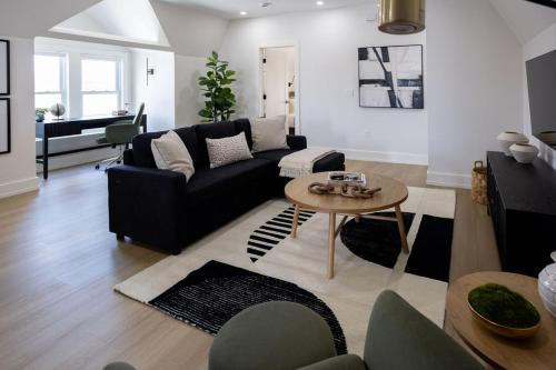 a living room with a couch and a table at Excellence by Urooms Apartments Near NYC and Newark Airport with Parking in Elizabeth
