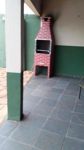 a toy oven in a corner of a room at Hotel Miracema Palace LTDA in Miracema do Norte