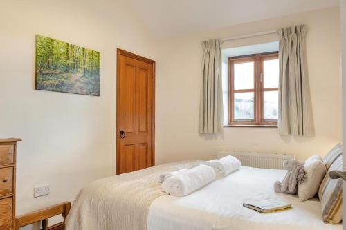 a bedroom with a bed with towels on it at 3 Bed in Whitwell oc-h33498 in Whitwell
