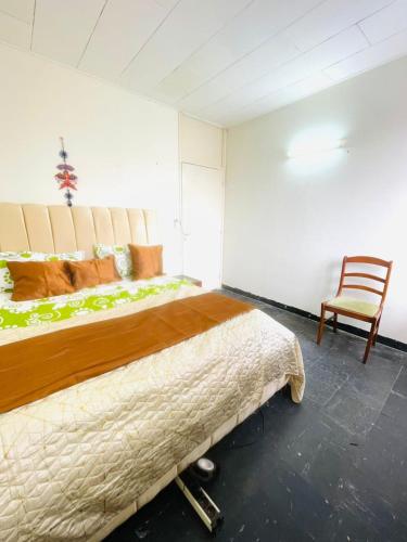 Llit o llits en una habitació de Jnelis Home