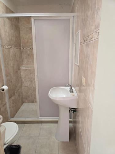 a bathroom with a toilet and a sink and a shower at Hotel Casa del virrey Atlixco in Atlixco