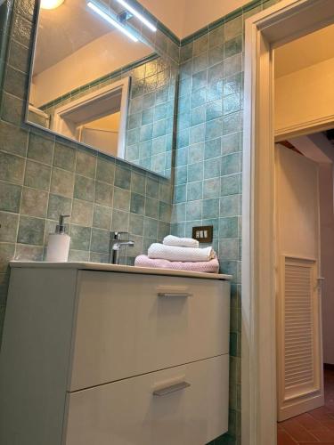 a bathroom with a sink and a mirror at Lovely Stay in Sesto Fiorentino