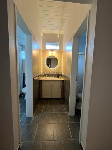 a bathroom with a sink and a mirror at Casa Marina in Monte Hermoso