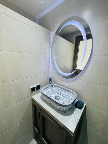 a bathroom with a sink and a mirror at بوابة الشمس 2 in Agadir