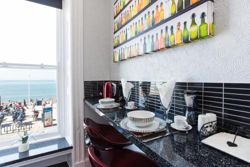 a bar with a view of the beach at Sea view Ar Lan y Mor LUXURY APARTMENT in Aberystwyth
