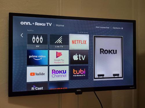 a television screen with many different logos on it at FULL KITCHEN 12min from DTOWN Room B in Montréal