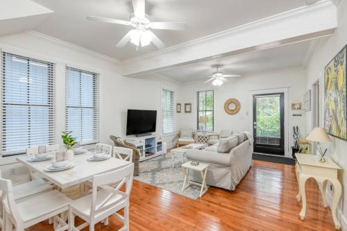 a living room with white furniture and a table at Mulberry Oasis in St. Augustine