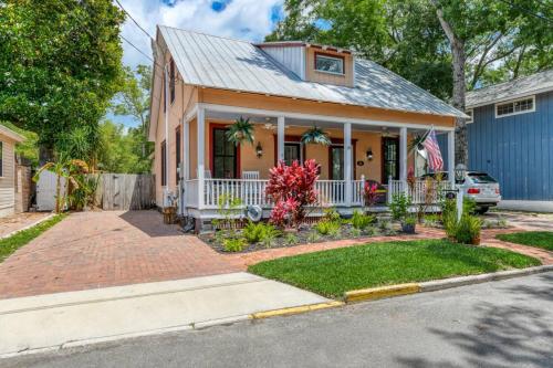 a house with a flag on the front of it at Mulberry Oasis in St. Augustine