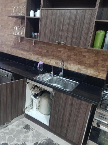 a kitchen with a sink and a counter top at Sky Star Villa 97 in Hurghada