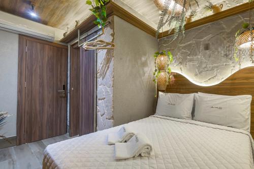 a bedroom with a large bed with a white bedspread at Leblon Beach Hostel in Rio de Janeiro