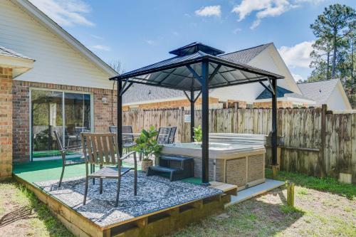 a gazebo with a grill and a chair at Orange Beach Home with Hot Tub Less Than 2 Mi to The Wharf in Orange Beach