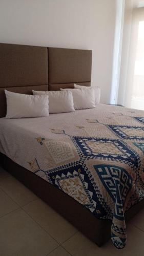 a bed with a colorful quilt on top of it at Perfect location 2 bedrooms Romantic Zone PV 601 in Puerto Vallarta